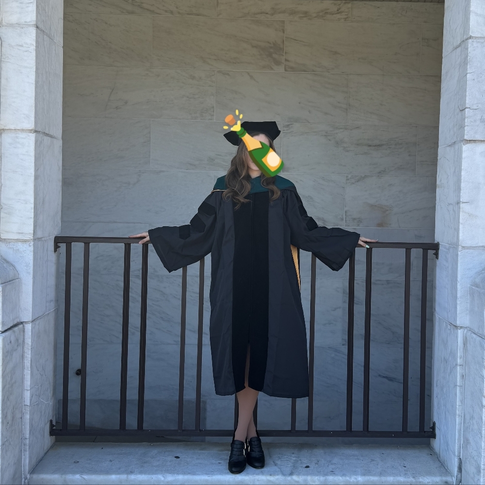Black Doctoral graduation gown and tam